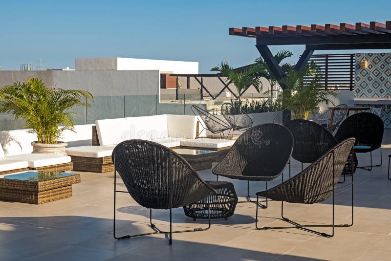 Modern building rooftop terrace with stylish chairs royalty free stock photography