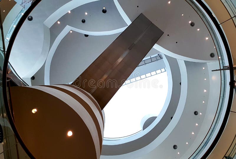 Modern escalator hall with circle shape , multi level round floor and ceiling shape design when looking up.Exhibition Hall Bangkok royalty free stock photography