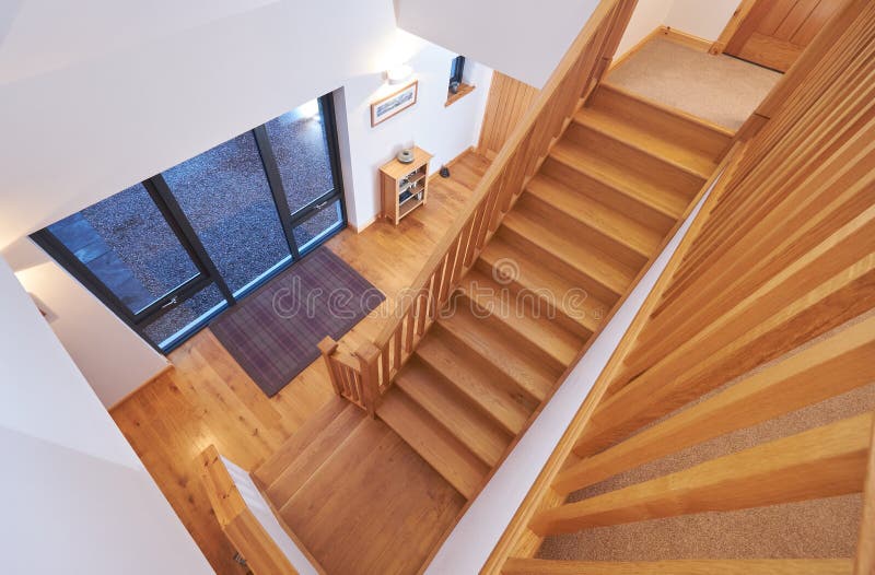 Modern Home Interior. Looking down the stairs towards the doorway of a modern home interior stock photos