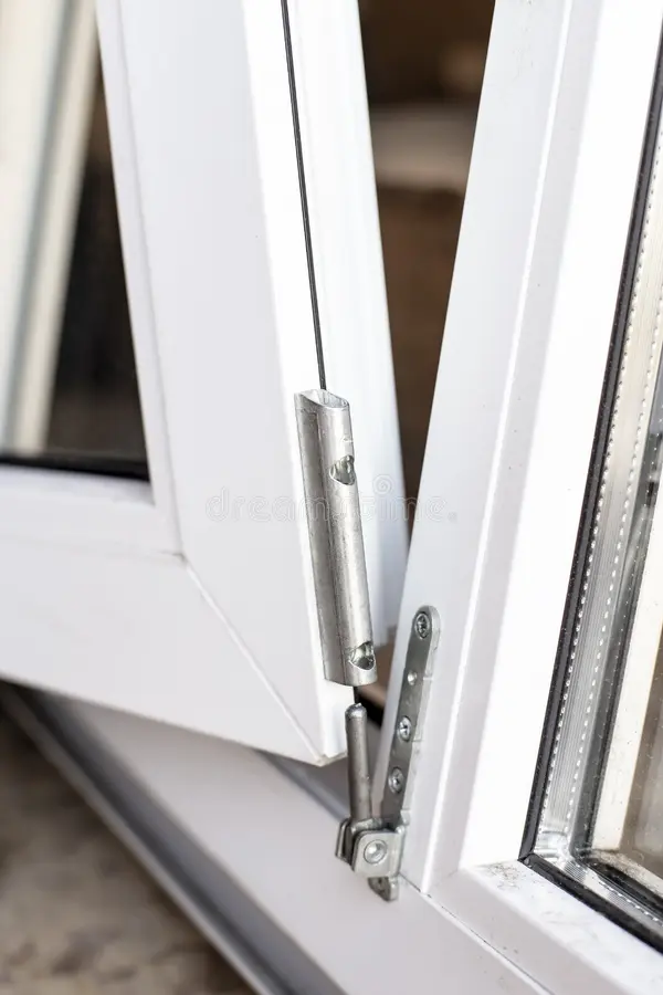 The movable part of the PVC window is connected to the frame usi stock photos