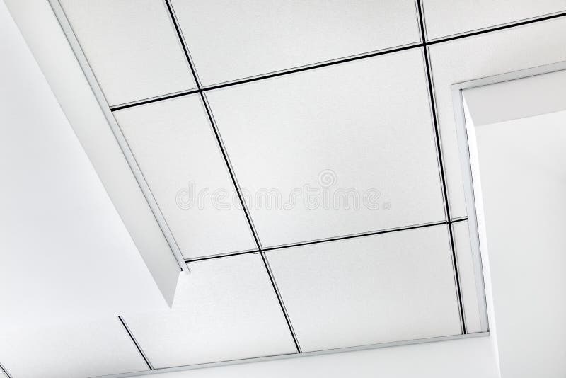 Multi level ceiling pattern with three dimensional protrusions and a suspended tiled ceiling. royalty free stock photography
