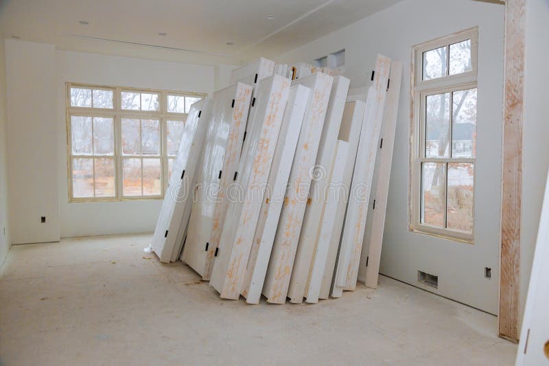 New home installing material for repairs in an apartment is under construction, remodeling, rebuilding and renovation door. New home installing material for stock image