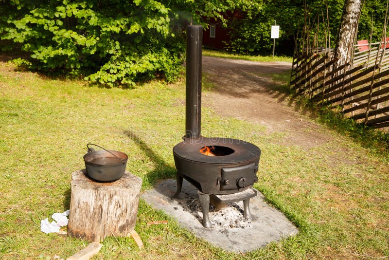 Norwegian vintage stove. With fire in Folk museum in Oslo stock photos