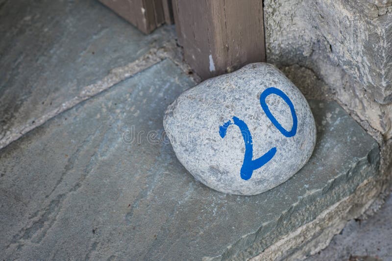 Number of the room on the big stone. In the Greece hotel stock photos