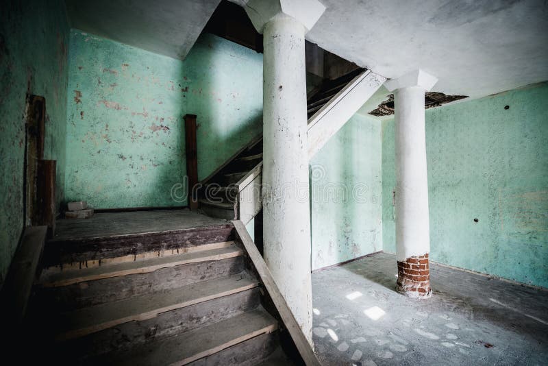 Old abandoned creepy manor house room. Stairs to the second floor. Šumskas Manor is a former residential manor in Šumskas, Vilnius District Municipality stock photography