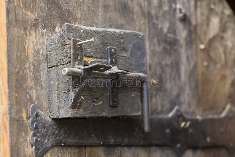 Old door closing mechanism from a fortress stock image