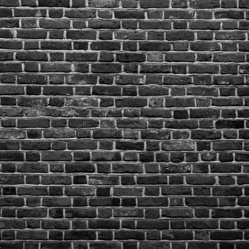 Old Grunge Black and White Brick Wall Background. Abstract Brickwall Texture Close up. Monochrome Background. Square Wallpaper or royalty free stock image