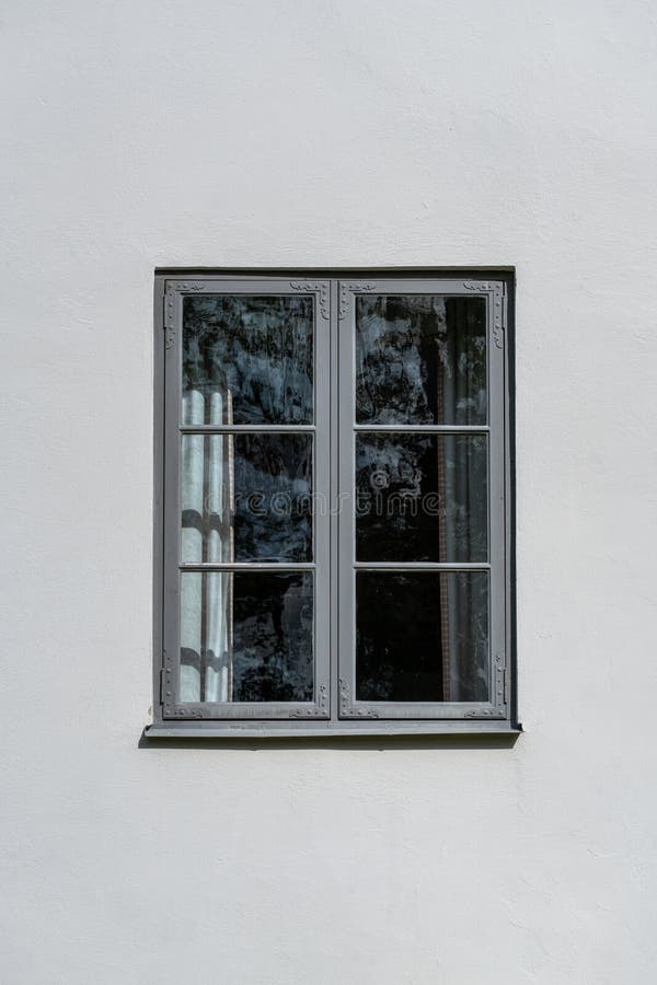 One single gray window on a bright white wall stock photos