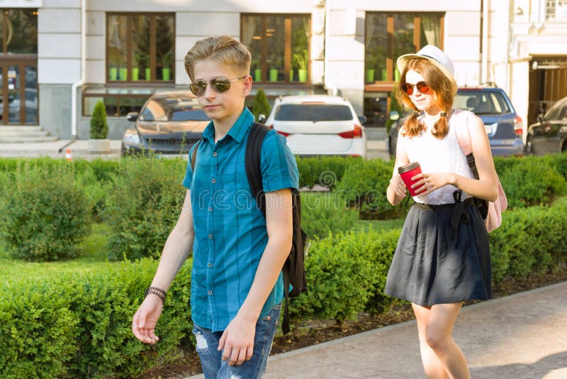 Outdoor portrait of a teenage boy and girl 14, 15 years old.  stock photography