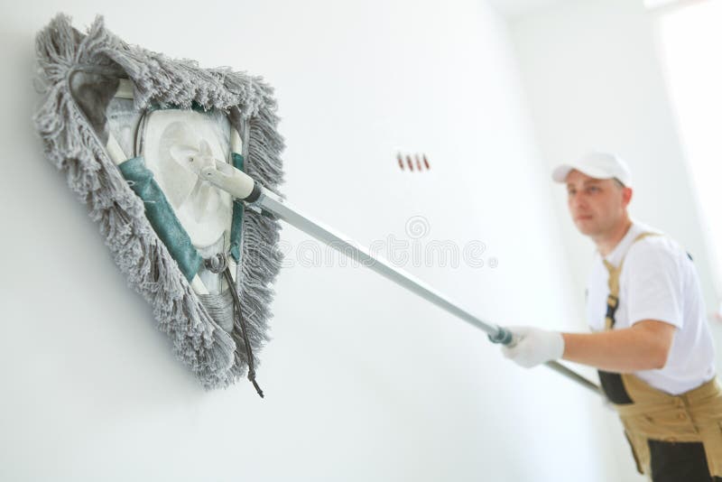 Painter works with triangle drywall cleaning tool. Surface preparation for painting. Painting preparation at home impovement. Painter cleaning drywall after stock photos