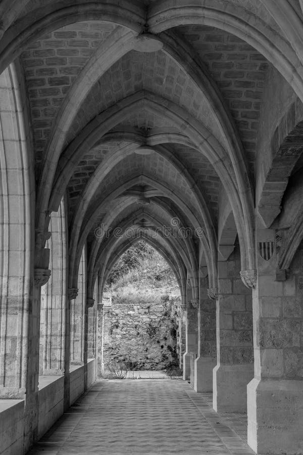 Panoramic view of a beautiful arcade with vaulted ceilings in a reconstructed monastery in Xàtiva, Spain. Black and white image.  stock photography
