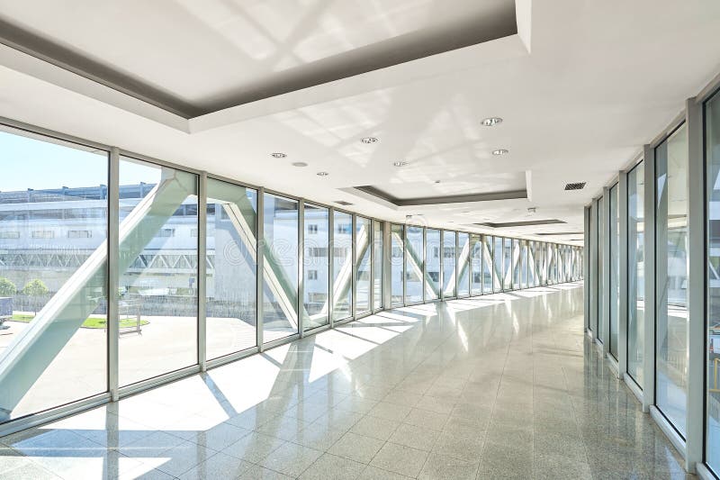 Panoramic view on empty office hall with glass wall windows. made of metal and glass. Modern corridor metal and glass construction. Commercial architecture royalty free stock photography