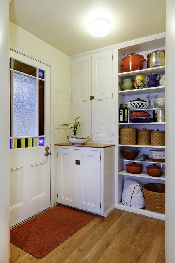 Pantry view with storage shelves in Small hallway. stock photography