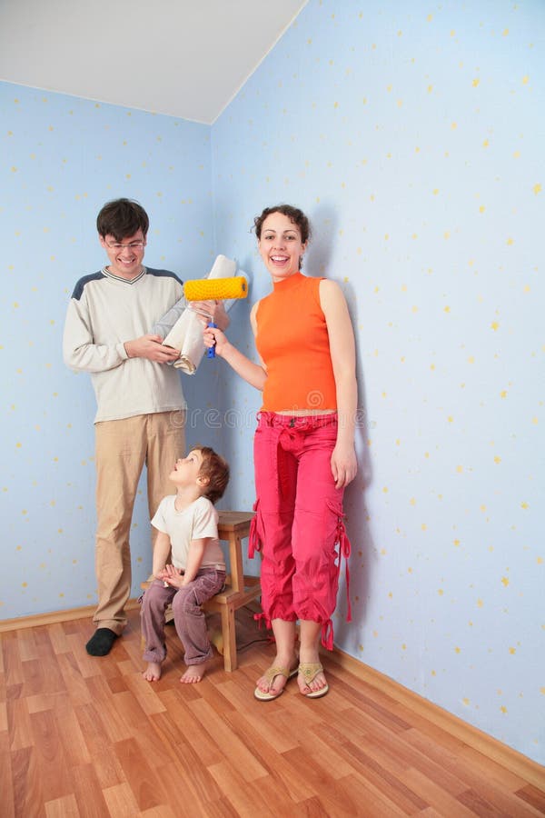 Parents with daughter in room after repair. Parents with daughter in the room after repair stock images