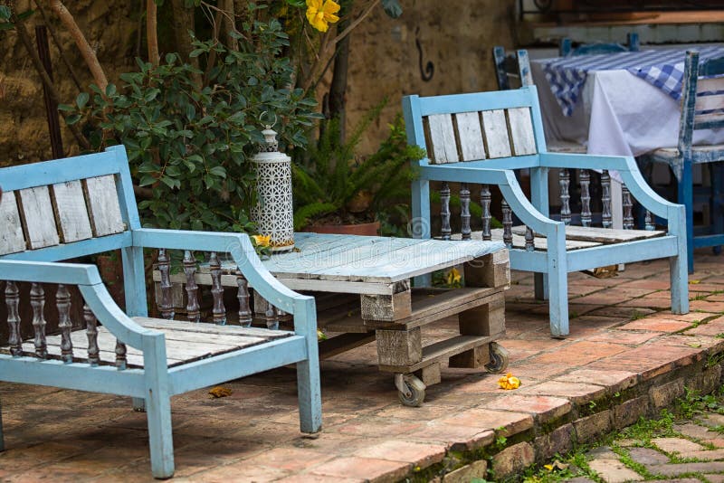 Patio furniture made using reclaimed wood in Colombia. Rustic outdoor patio furniture made of reclaimed wood stock photo