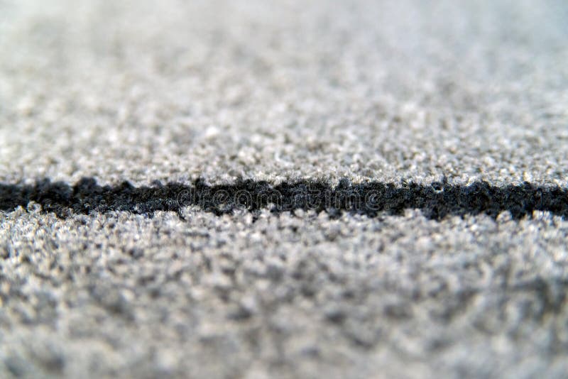 Perspective of grey carpet with black lines background texture, close up, gray textile texture, fluffy rug background. Selective. Perspective of grey carpet with royalty free stock photos