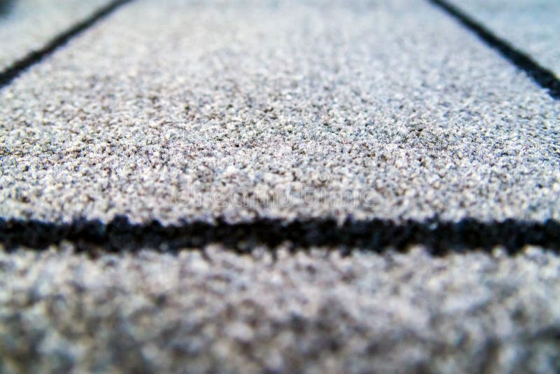 Perspective of grey carpet with black lines background texture, close up, gray textile texture, fluffy rug background. Selective. Perspective of grey carpet with stock image