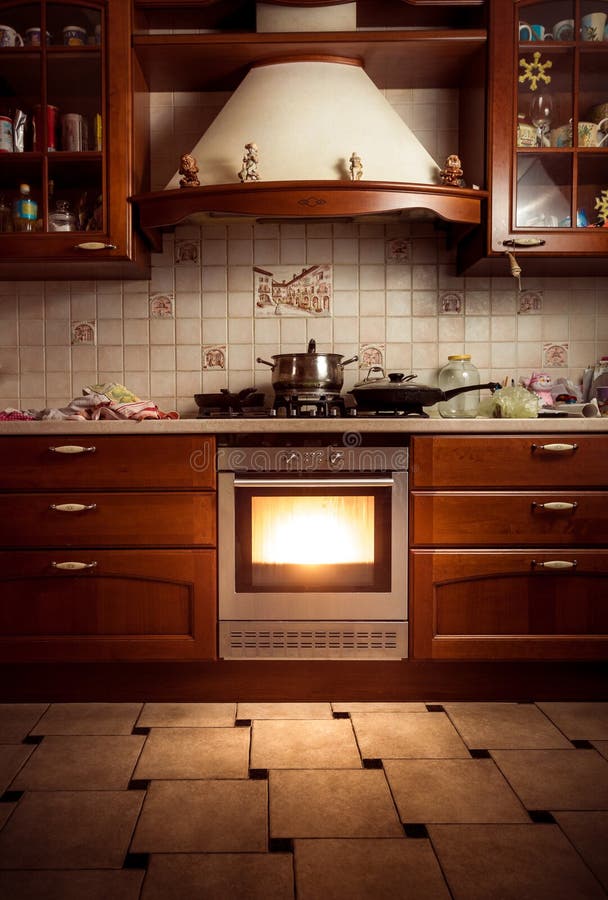 Photo of country style kitchen with hot oven. Interior photo of country style kitchen with hot oven stock image