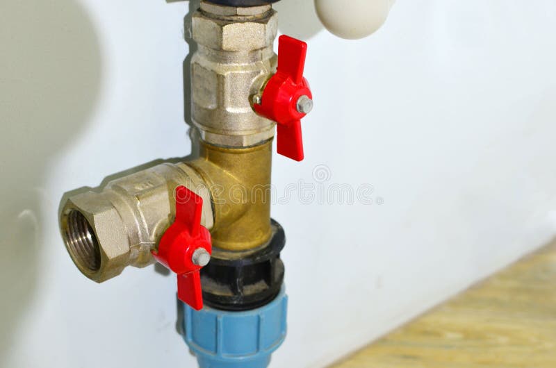 Piping and plumbing fitting in the home  industry of the modern era. Connecting pipe warm water floor to the manifold heating. Plumbing Pipes and Fixtures stock photos