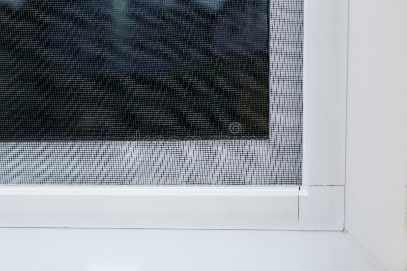 Plastic window with mosquito net. Outdoor detail closeup royalty free stock images