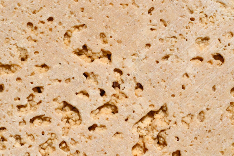 The popular travertine variety Travertine Classic is a warm beige color with pronounced pores and pattern heterogeneity. Travertine Classic is a warm beige color royalty free stock photography