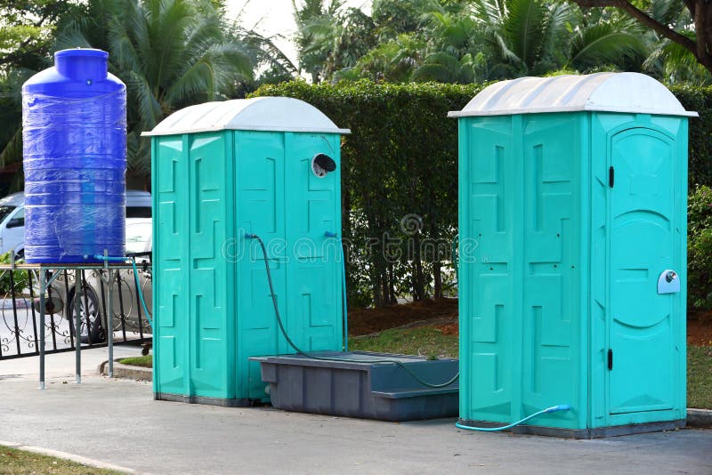 Portable toilet. Green color Portable toilet with blue color water tank ready to service people for outdoor event royalty free stock images