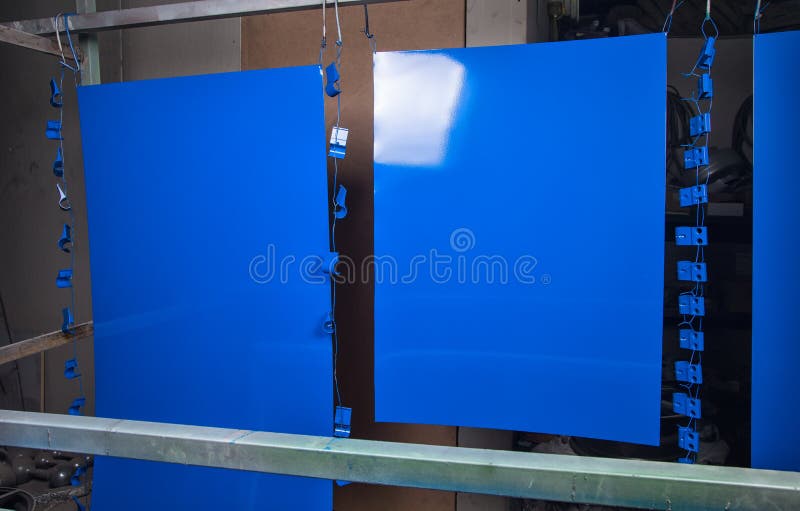 Powder coating and drying of blue details. In workshop royalty free stock image