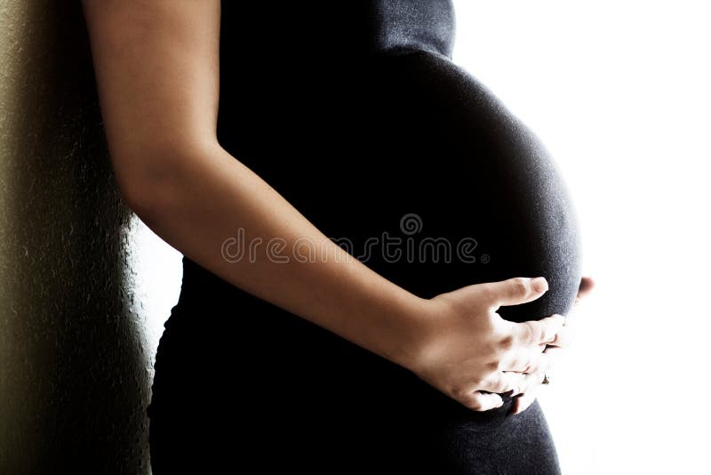 Pregnant Woman Holding Belly royalty free stock images