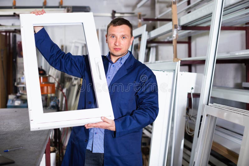 Professional labour with finished PVC profiles and windows at fa stock photography