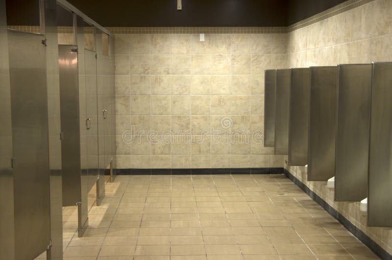 Public bathroom interiors. Clean and simple interiors of a bathroom in a mall royalty free stock image