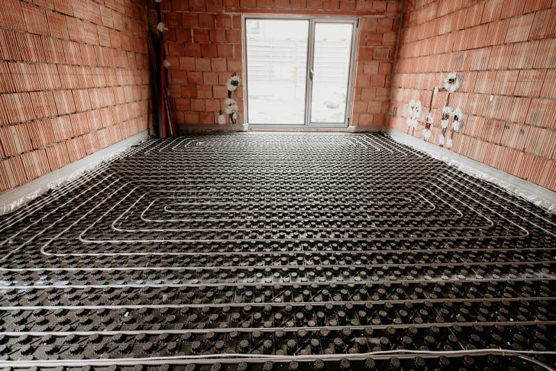 Radiant floor construction installation with flexible pipes. Installation of underfloor heating stock images
