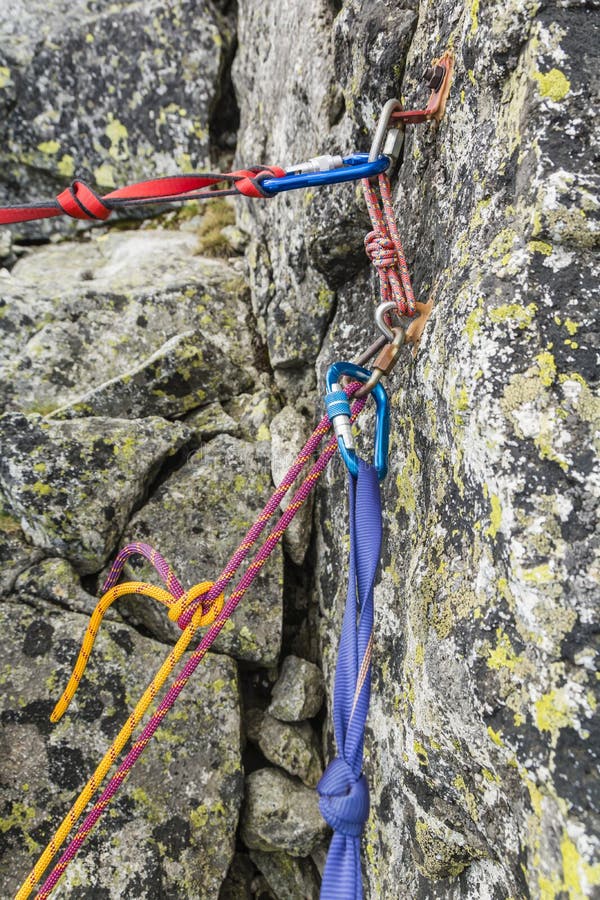 Rappel stance, safety loop and rappel rope while preparing for rappelling from the rappel anchor after finishing climbing in the. Rappel stance - safety loop and stock photo