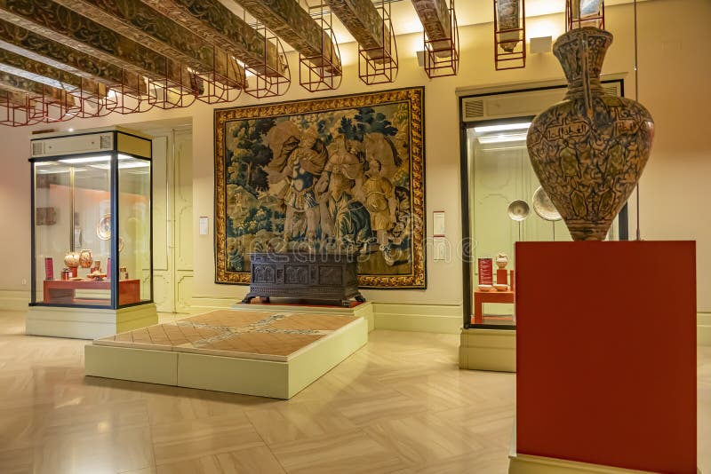 The red room in the Museo Nacional de Ceramica with pottery, carvings, tapestries and a beautiful ceiling, Valencia, Spain.  stock images