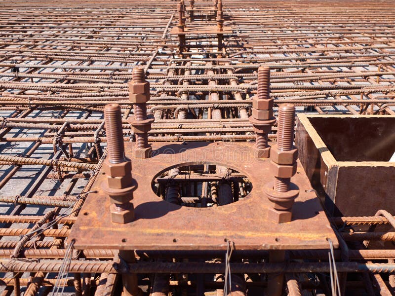 Reinforcement of concrete reinforced foundation with metal anchor bolts designed for the installation of metal columns.  stock photography