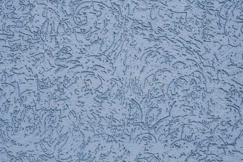 The ribbed pastel surface of concrete wall. Abstract pattern on blue wall. Embossed of stucco. Texture of paint on grooved plaster. Light blue background with royalty free stock image