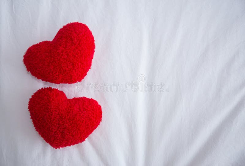 Romantic interior for Valentine`s day with bed. Romantic interior for Valentine`s day with bed, pillows shaped heart royalty free stock image