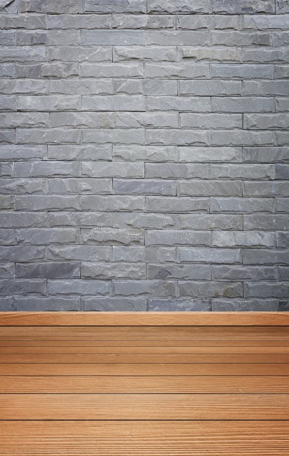 Room interior with brick stone tiles wall and wood floor background. Empty room interior with brick stone tiles wall and wood floor background stock image