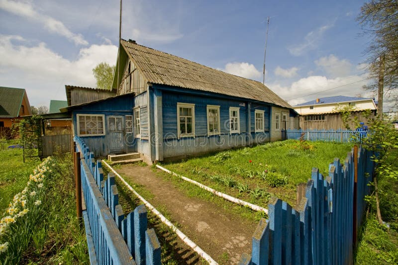 Russian village garden. The traditional rural wooden house in Russian province stock images