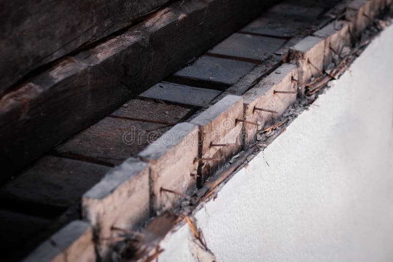 Rusty nails in old wooden wall, construction concept.  stock photography