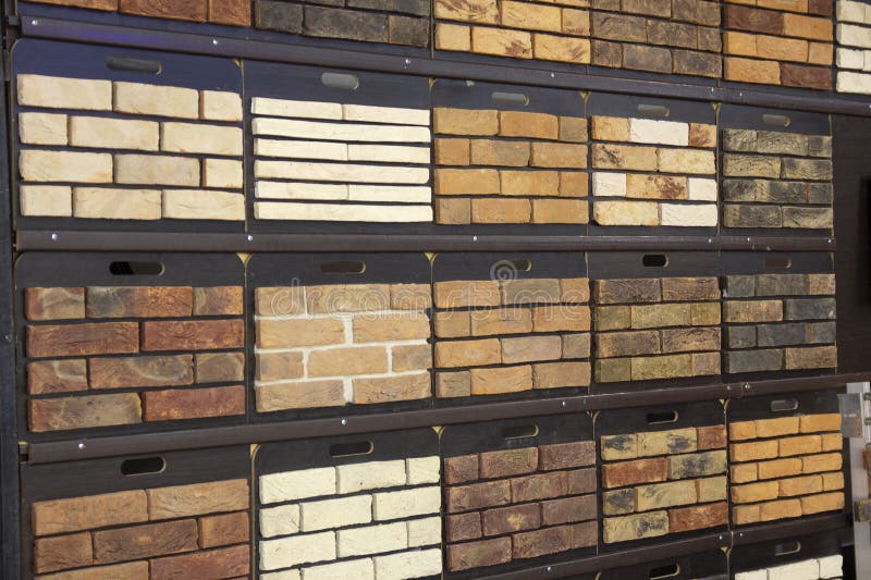 Samples of decorative finishing stone in the exhibition hall stock photos