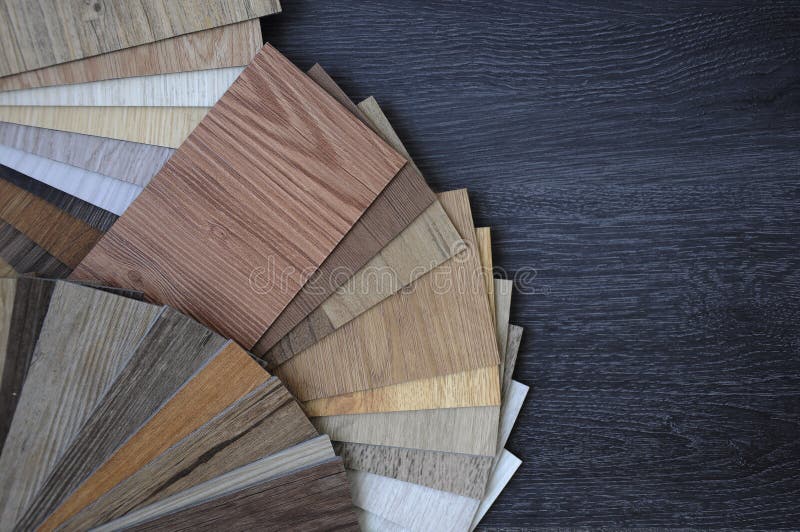 Samples of laminate and vinyl floor tile on wooden Background wood texture floor oak tile, maple tile, chestnut tile, walnut tile, royalty free stock images