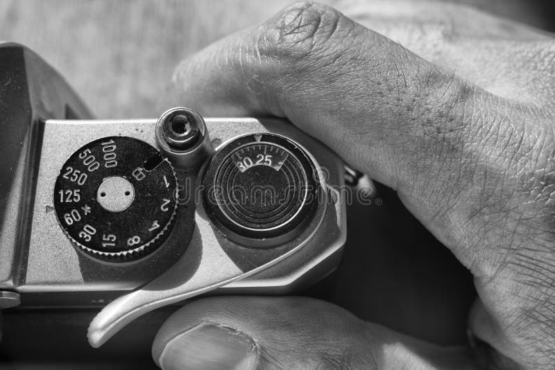 Setting preferences on a film camera. Black and white stock photography