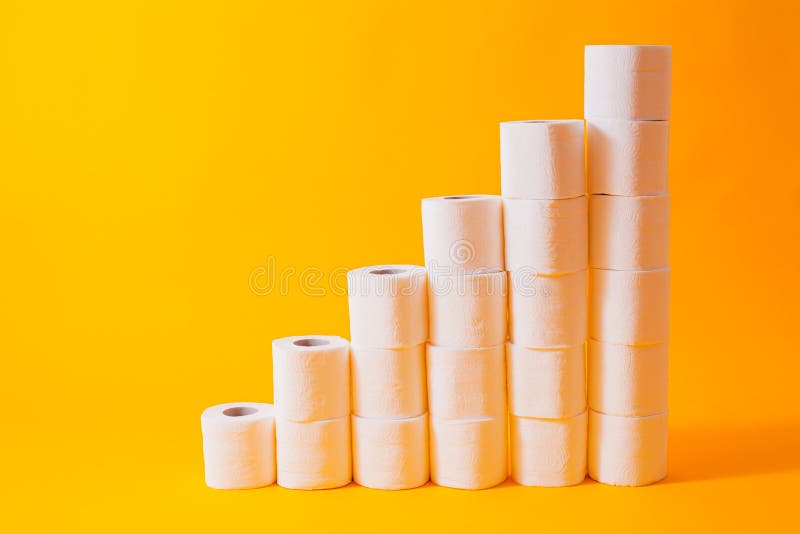 Shedule toilet paper rolls isolated on yellow. Background royalty free stock image