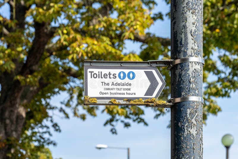 A sign giving directions to a member of community toilet scheme in teddington, london, England royalty free stock images