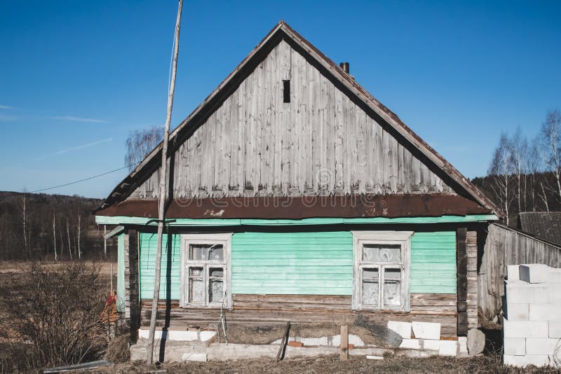 Small old wooden construction. shot on a bright sunny day. the house needs repairs. Text toning royalty free stock image