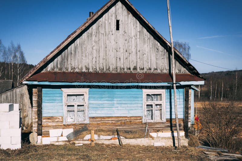 Small old wooden construction. shot on a bright sunny day. the house needs repairs. Text toning stock image