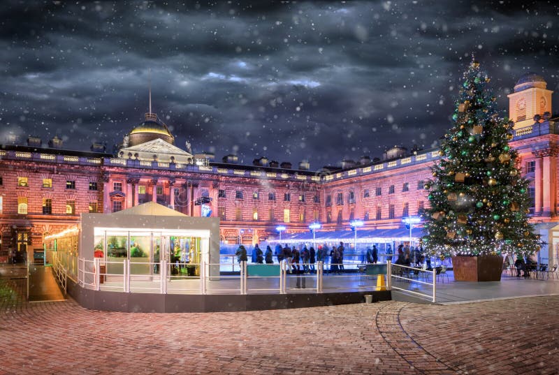The Somerset House in London with a ice rink and christmas tree. During winter with snowfall stock photography