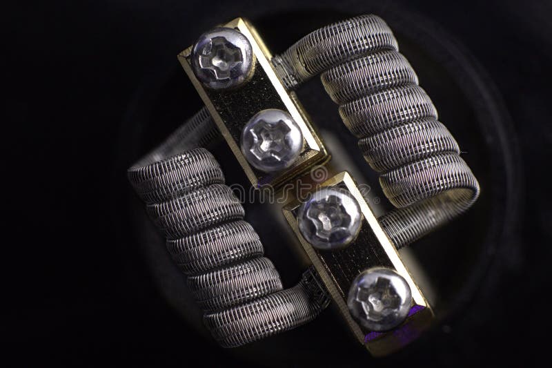 Staggerton fused clapton coil for vaping. Staggerton fused clapton coil on rda royalty free stock photos