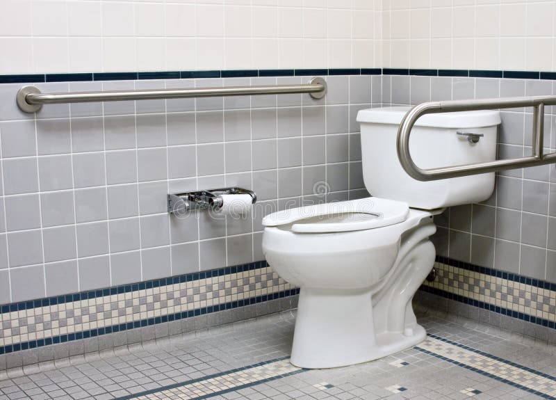 Stainless support bars in handicap bathroom stock image