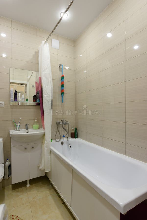 Standard bath in a combined apartment bathroom. Standard bath in a combined apartment  bathroom royalty free stock images
